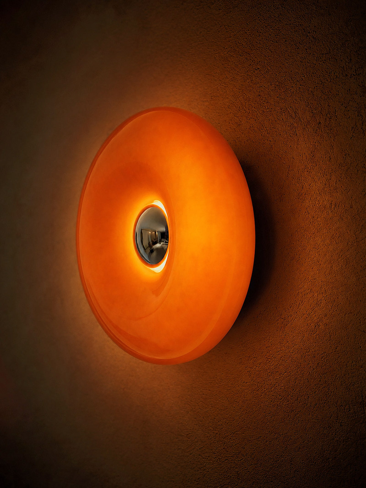 Ember mounted on a wall as a glowing ring, seen at an angle that shows its depth