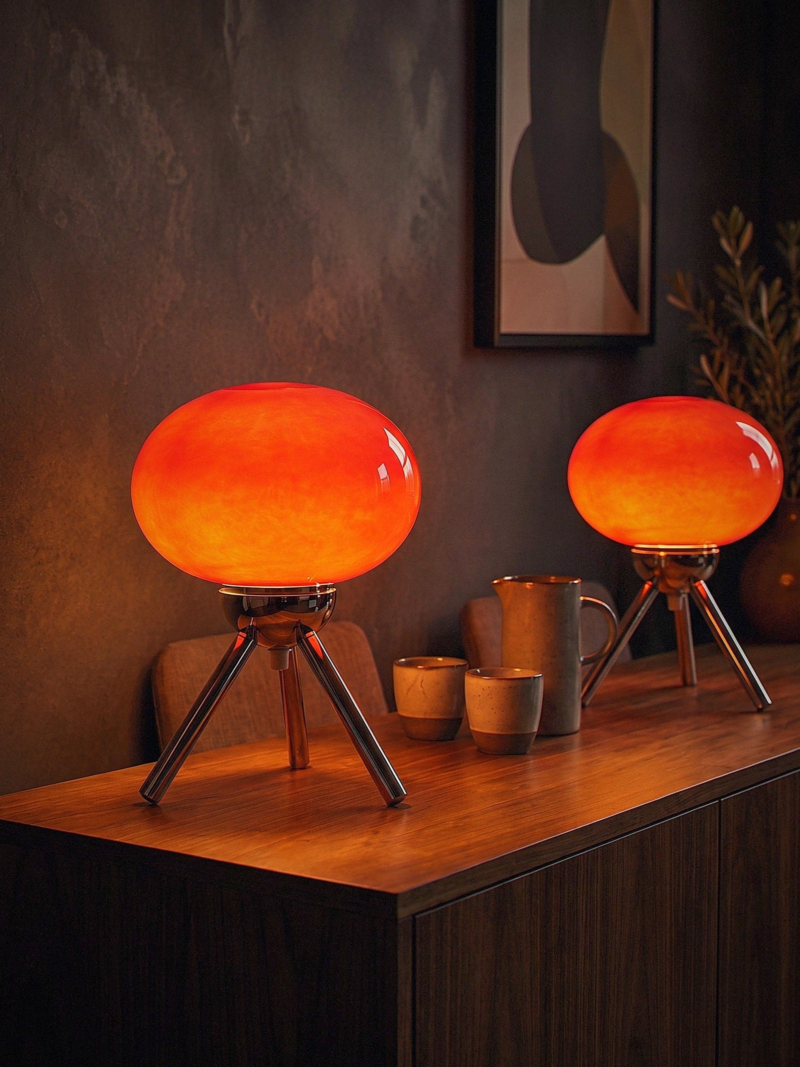 Two Prism lamps lit together on a dark walnut console, sold individually